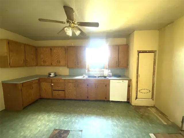 a kitchen with a cabinets and chandelier