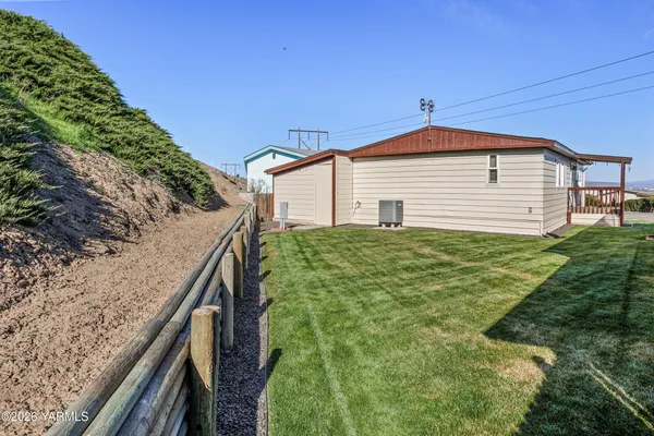 a backyard of a house with lots of green space