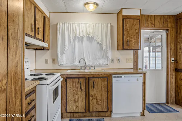 a kitchen with stainless steel appliances granite countertop a stove and a sink