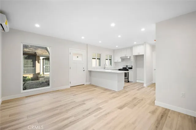 a view of kitchen with wooden floor