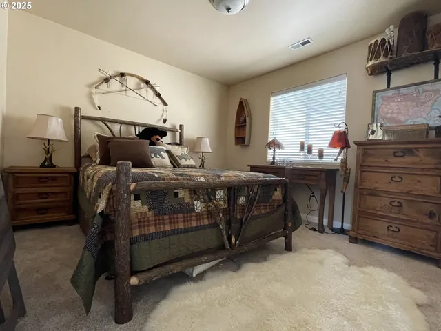 a bed room with furniture and a window