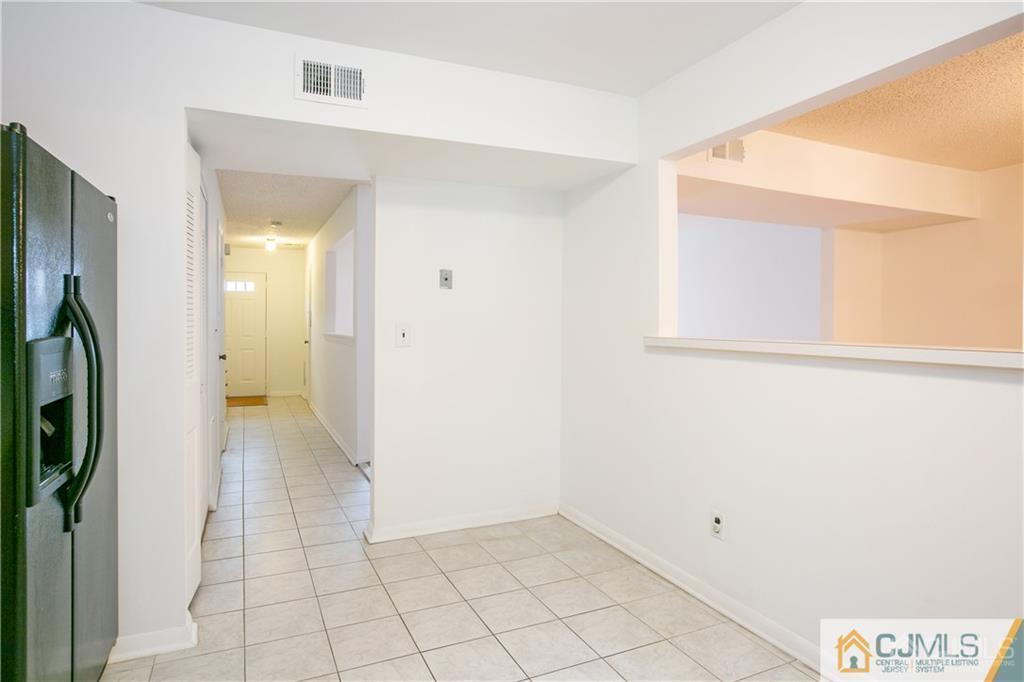 5106 Hana Road Edison, NJ 08817 - Photo 8 of 23 a view of a hallway with a white walls