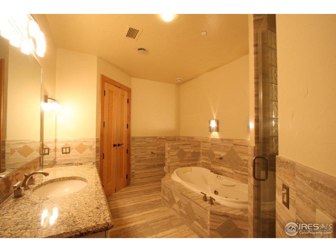 5385 Lookout Ridge Drive Boulder, CO 80301 - Photo 15 of 24 a bathroom with a sink mirror and shower
