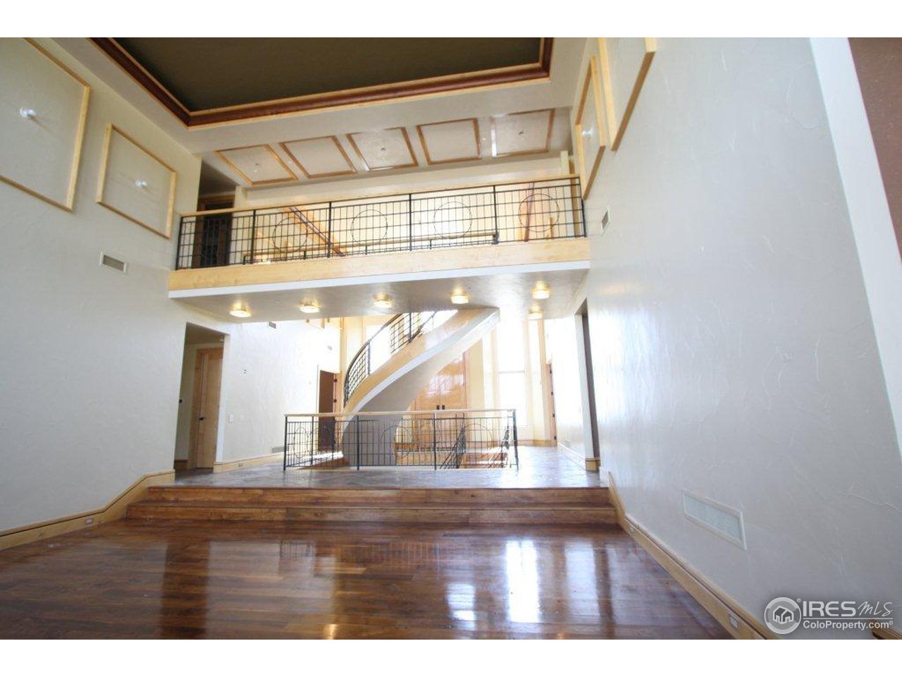5385 Lookout Ridge Drive Boulder, CO 80301 - Photo 9 of 24 a view of empty room with wooden floor and fan