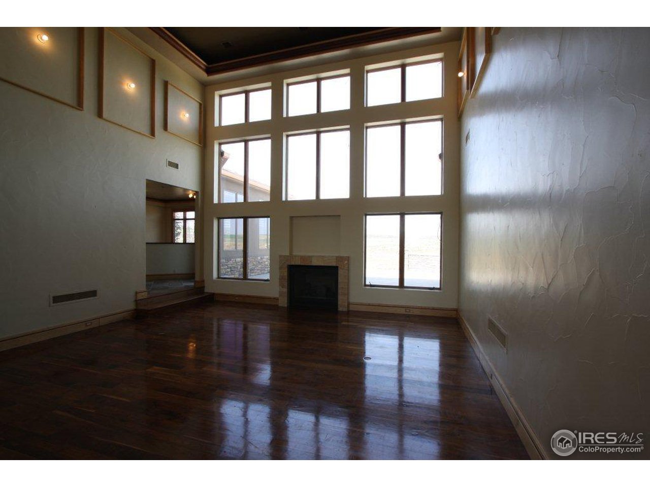 5385 Lookout Ridge Drive Boulder, CO 80301 - Photo 10 of 24 a view of empty room with wooden floor and fan
