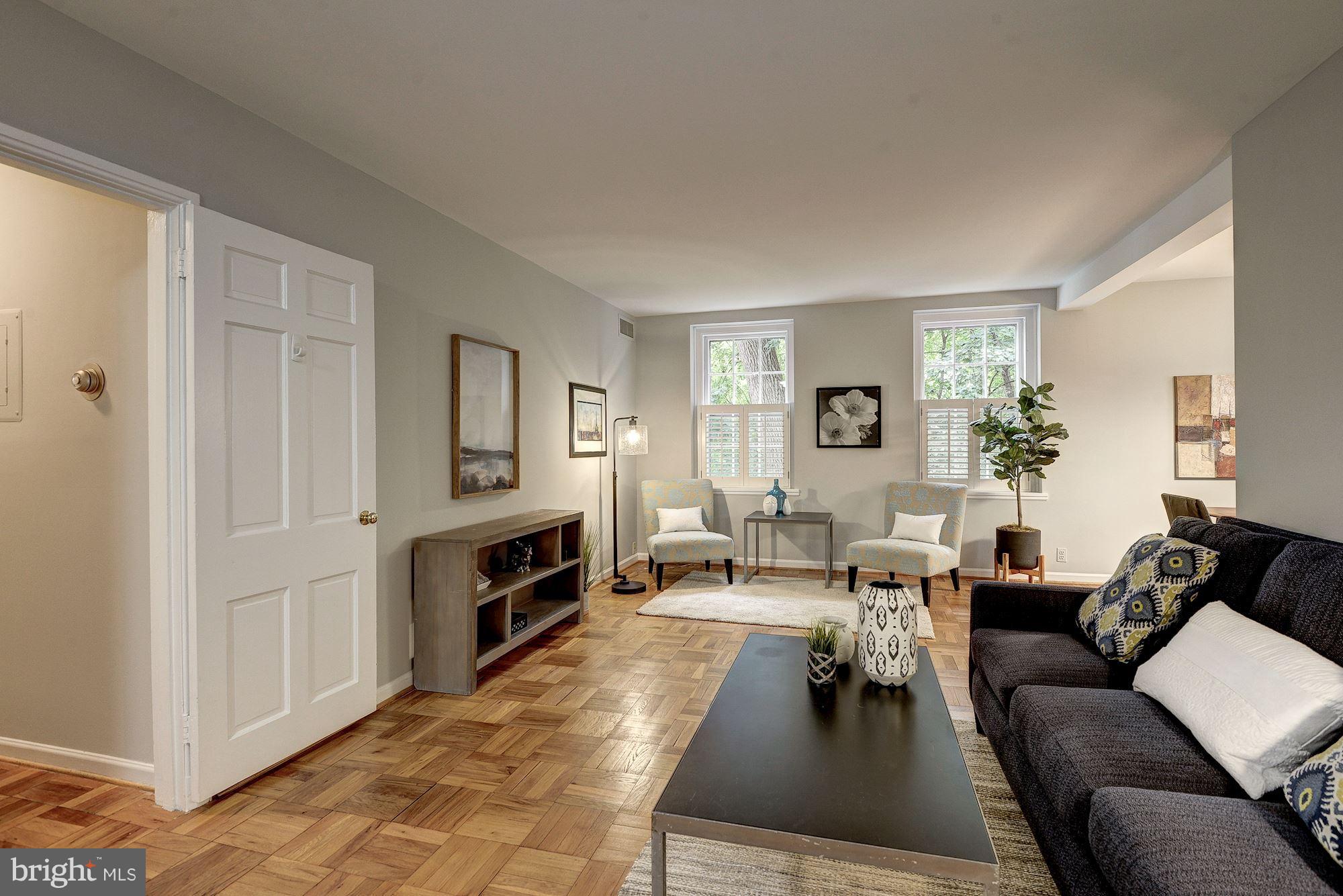 3500 39th Street Northwest, Unit B668 Washington, DC 20016 - Photo 2 of 29 a living room with furniture a fireplace and a window