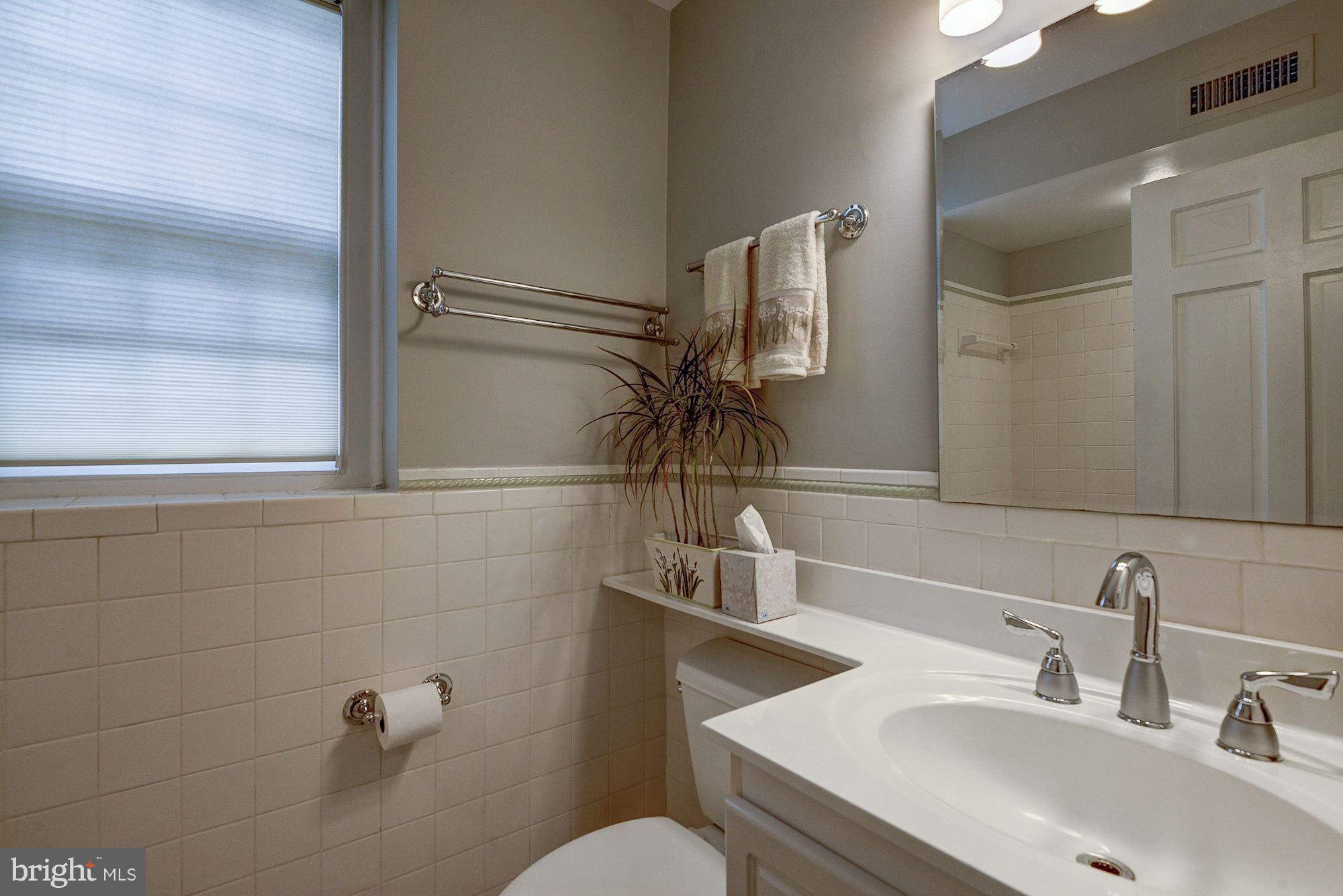 3500 39th Street Northwest, Unit B668 Washington, DC 20016 - Photo 17 of 29 a bathroom with a sink and mirror