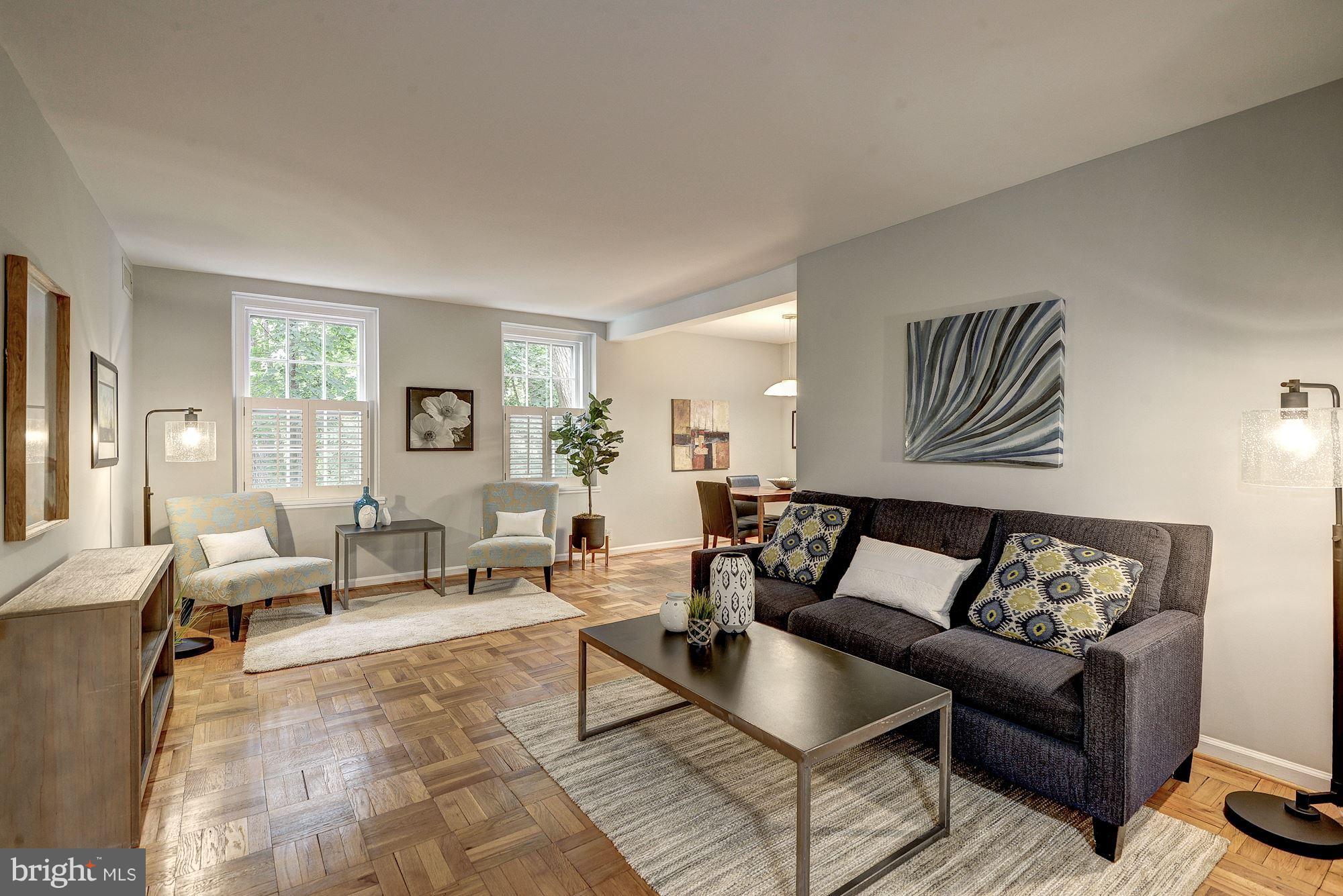 3500 39th Street Northwest, Unit B668 Washington, DC 20016 - Photo 3 of 29 a living room with furniture and wooden floor