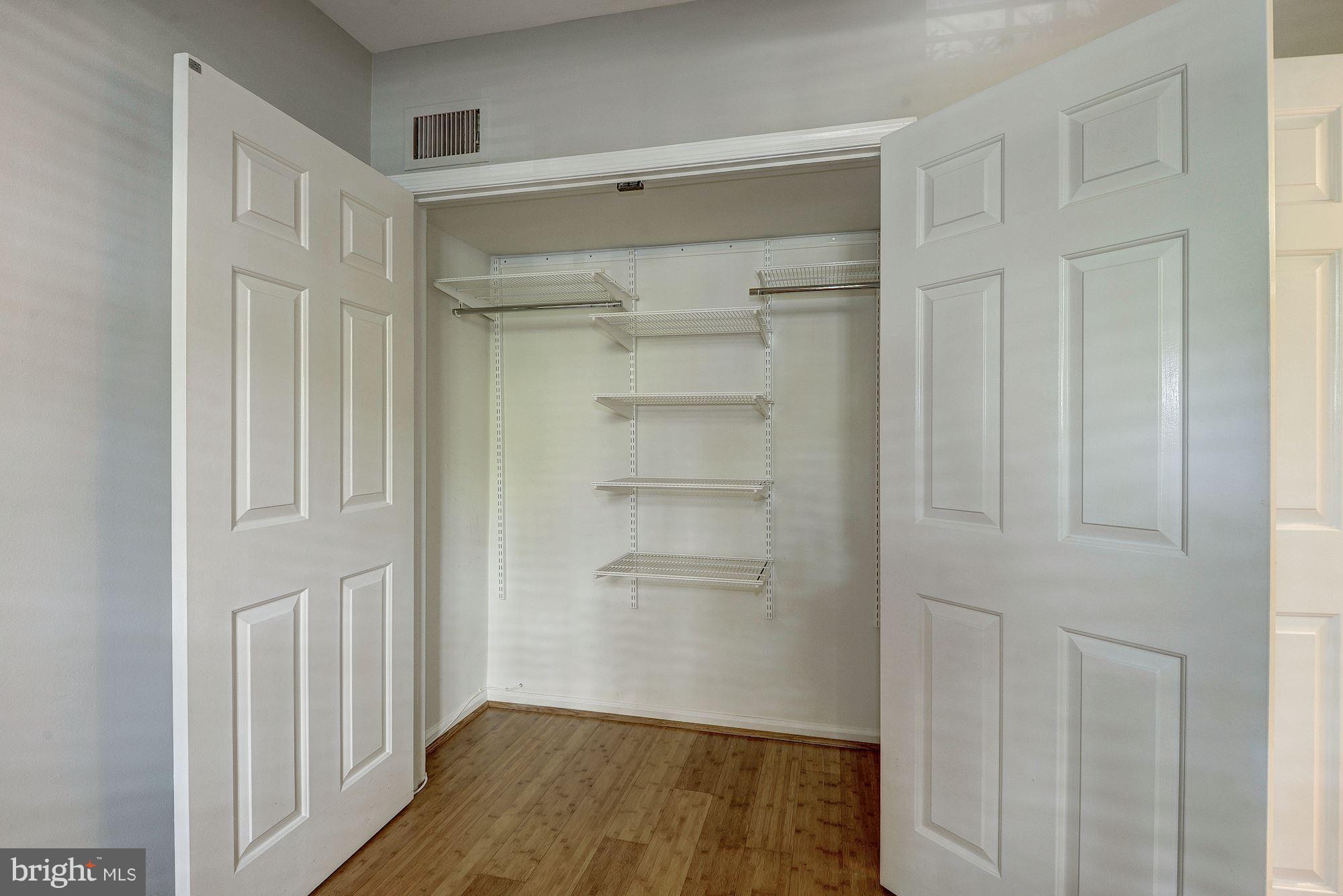 3500 39th Street Northwest, Unit B668 Washington, DC 20016 - Photo 27 of 29 a view of walk in closet with empty racks