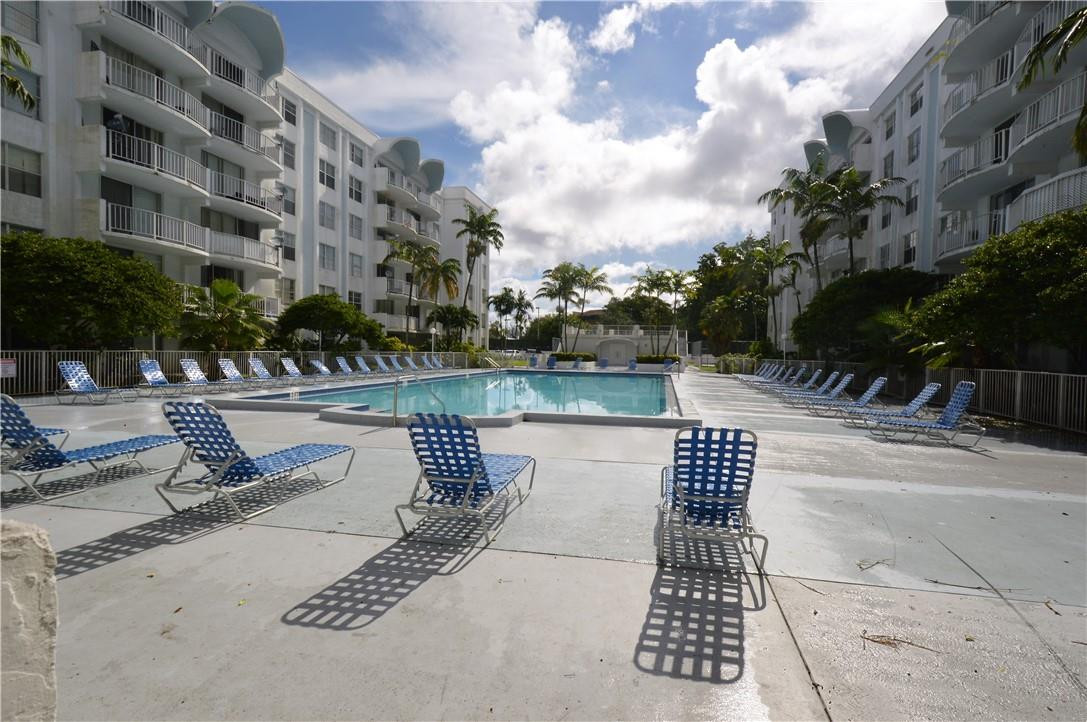 496 Northwest 165th Street, Unit D511 Miami, FL 33169 - Photo 1 of 16 a view of outdoor space with seating
