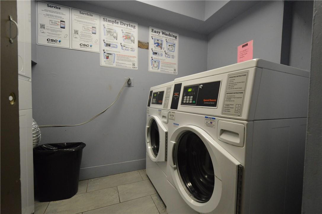 496 Northwest 165th Street, Unit D511 Miami, FL 33169 - Photo 12 of 16 a utility room with dryer and washer