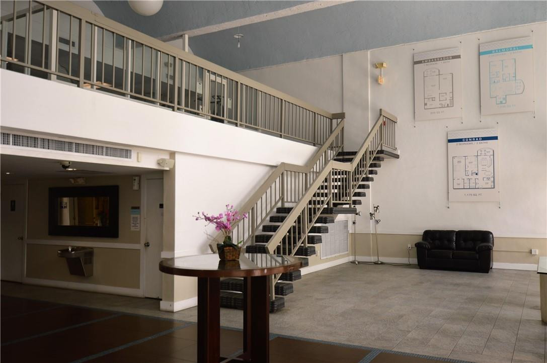 496 Northwest 165th Street, Unit D511 Miami, FL 33169 - Photo 13 of 16 a view of entryway and hall with wooden floor