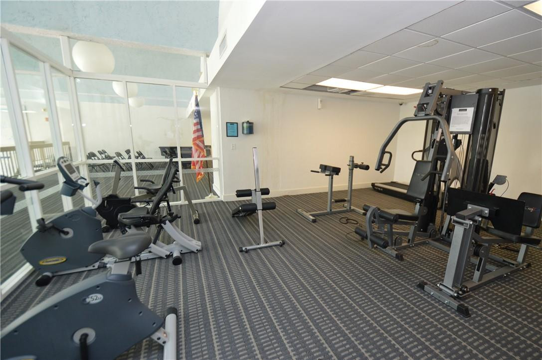 496 Northwest 165th Street, Unit D511 Miami, FL 33169 - Photo 2 of 16 a view of a room with gym equipment
