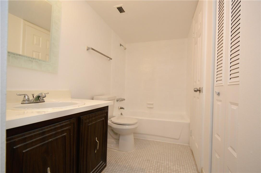 496 Northwest 165th Street, Unit D511 Miami, FL 33169 - Photo 5 of 16 a bathroom with a sink a toilet and a shower