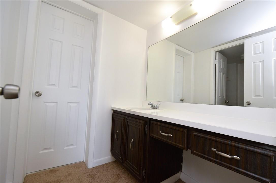 496 Northwest 165th Street, Unit D511 Miami, FL 33169 - Photo 8 of 16 a room with a sink vanity and mirror