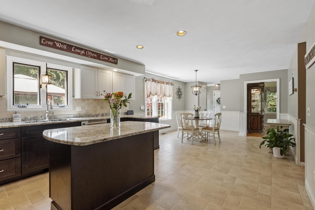 4 Ridge Road Pepperell, MA 01463 - Photo 10 of 42 a kitchen with counter top space and dining table