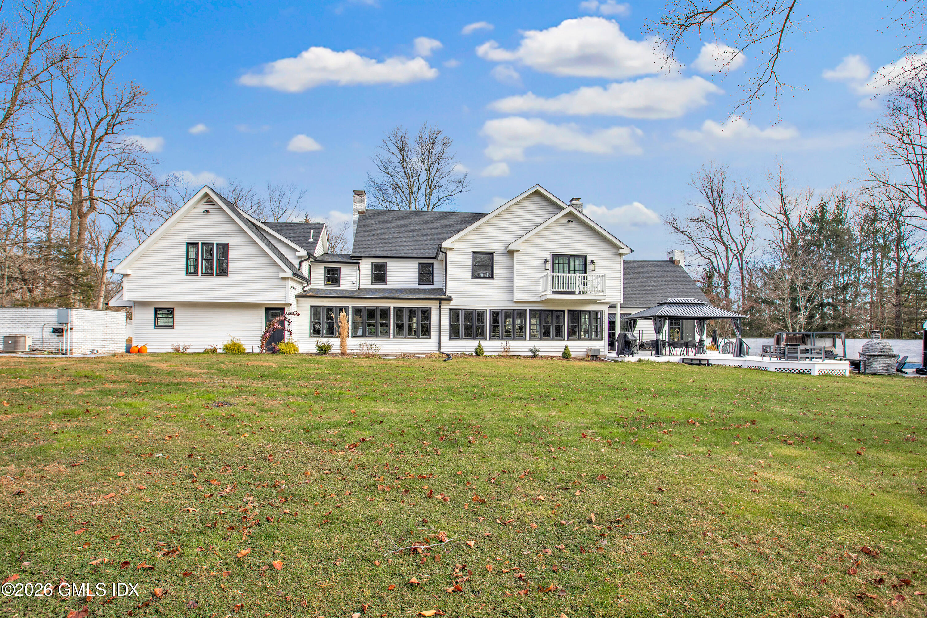 23 Meeting House Road Greenwich, CT 06831 - Photo 2 of 46 a view of a big house with a big yard and large trees