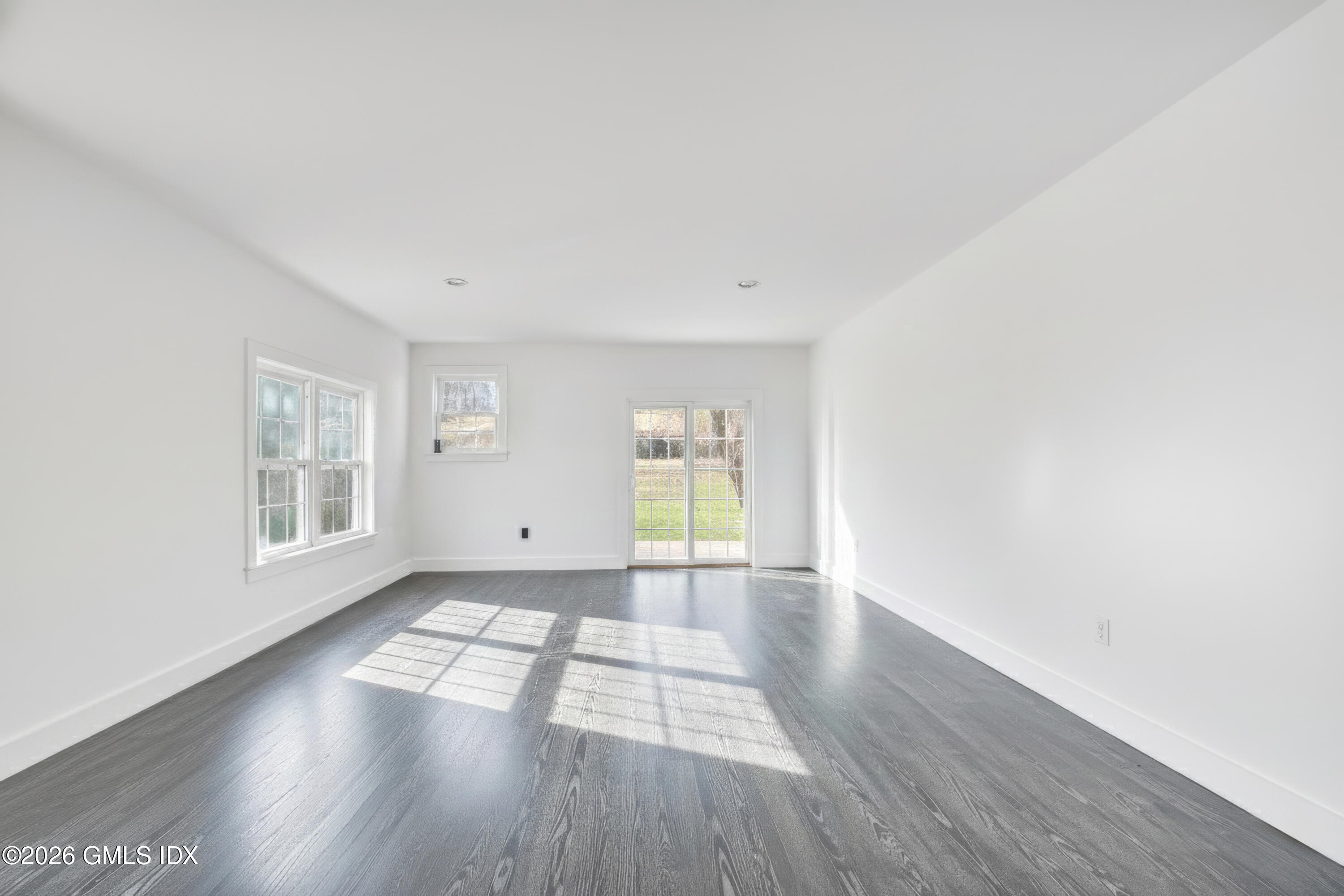 23 Meeting House Road Greenwich, CT 06831 - Photo 44 of 46 a view of an empty room with wooden floor and a window