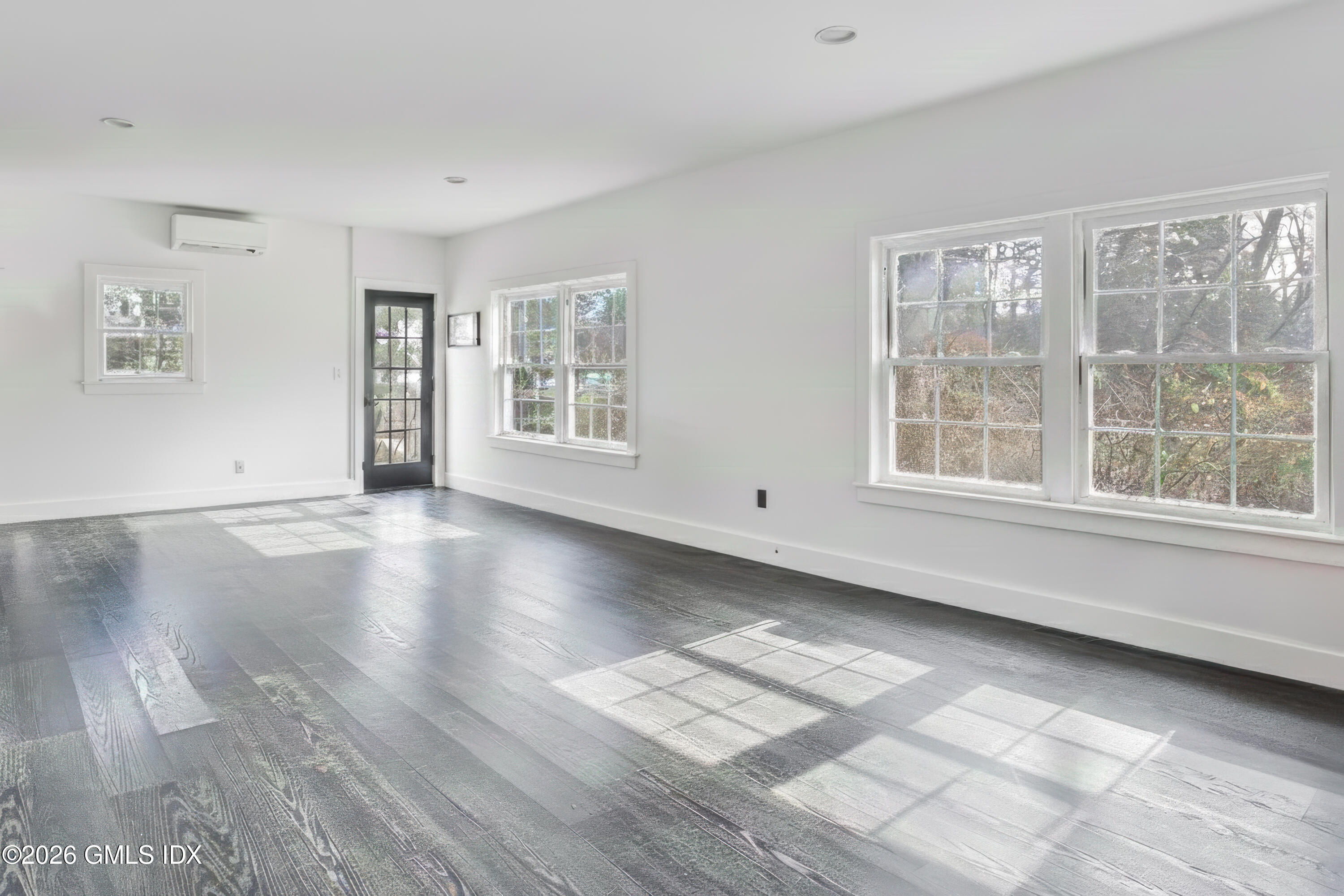 23 Meeting House Road Greenwich, CT 06831 - Photo 45 of 46 a view of an empty room with wooden floor and a window