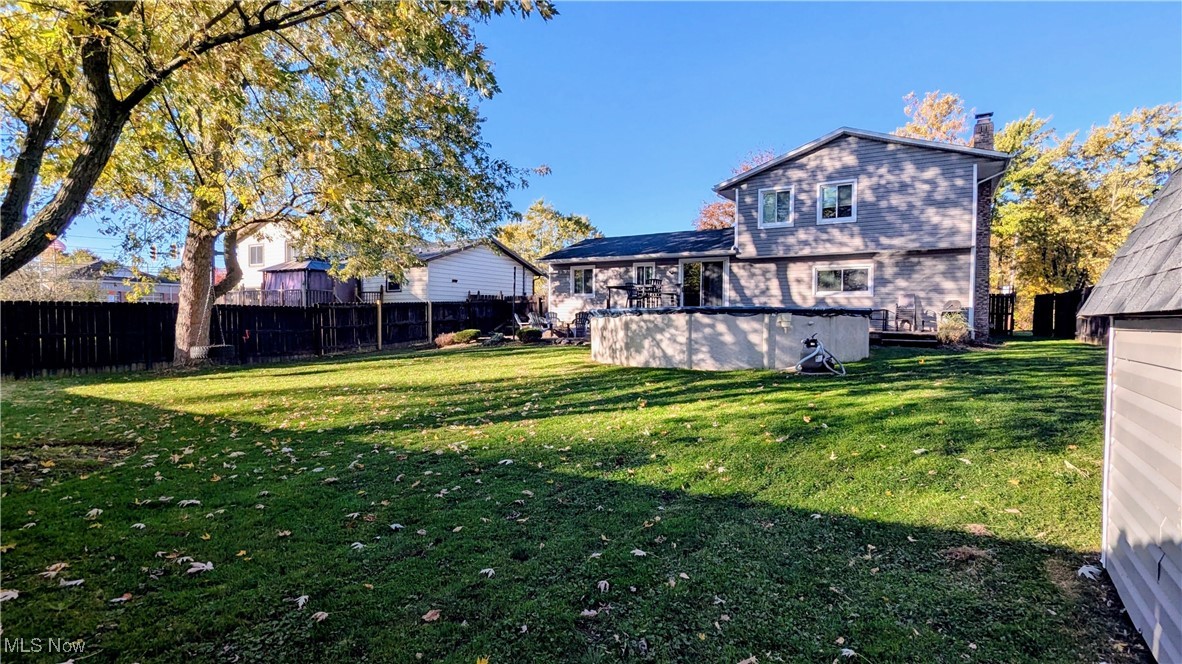 17567 Howe Road Strongsville, OH 44136 - Photo 3 of 30 View of Back of Home and Spacious Backyard .37 Acres lot, Fully Fenced Yard, Vinyl Storage Shed, Two Tier Deck, Newer Above Ground Pool, Patio with Firepit