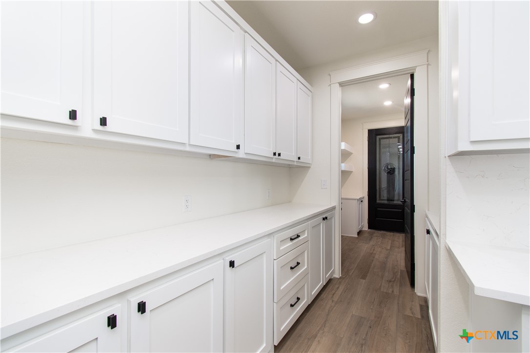 4245 Stringtown Road Temple, TX 76501 - Photo 8 of 25 a kitchen with white cabinets