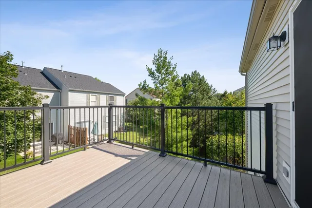 a view of a balcony with wooden floor