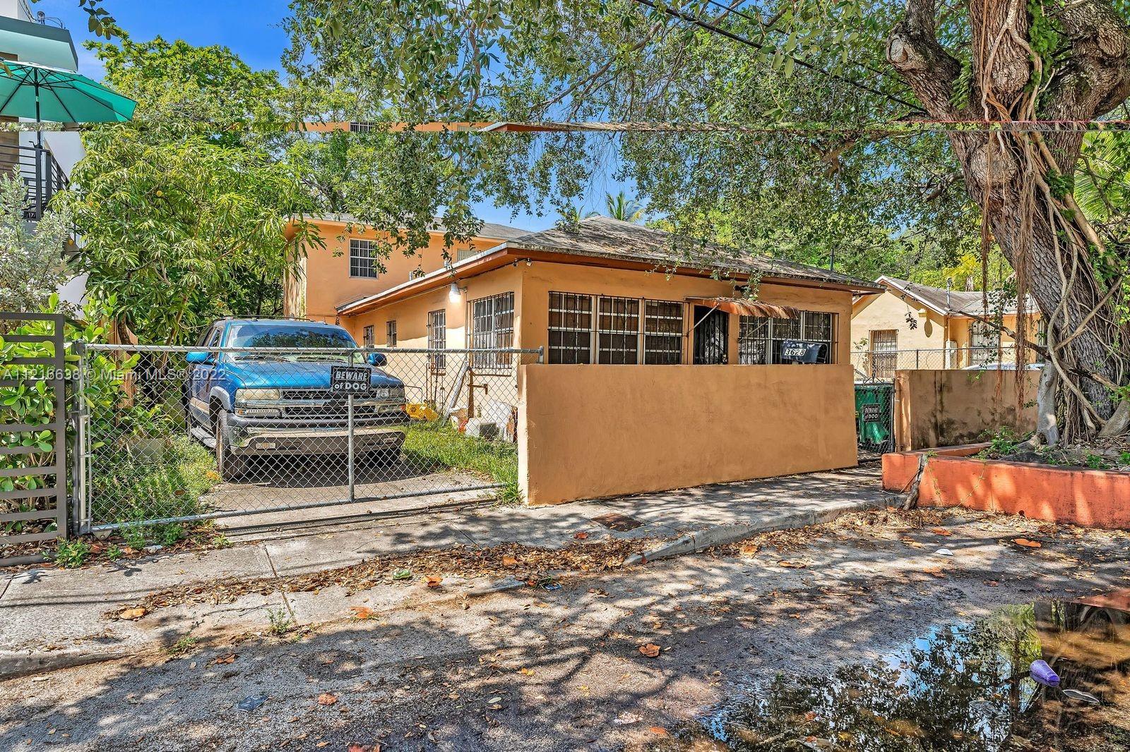 3628 Thomas Avenue Miami, FL 33133 - Photo 2 of 7 a front view of a house with a yard