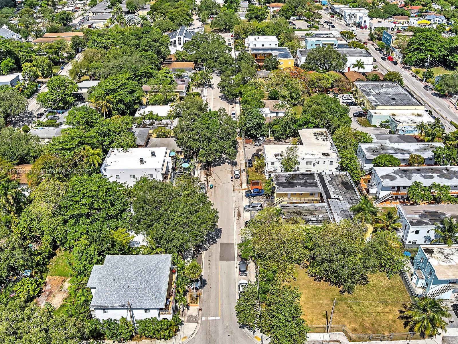 3628 Thomas Avenue Miami, FL 33133 - Photo 6 of 7 an aerial view of residential houses with outdoor space