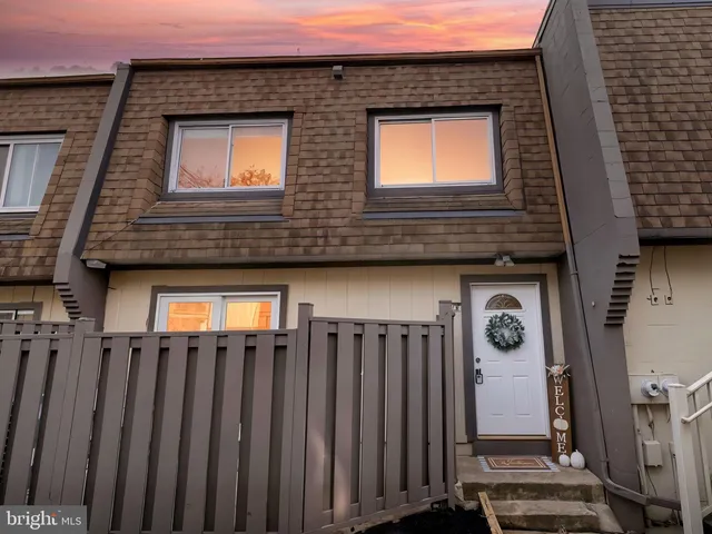 a front view of a house with stairs