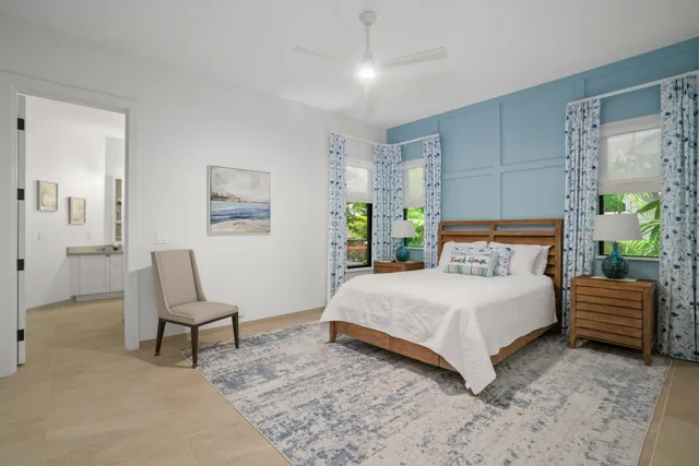 a bedroom with a bed and a chair