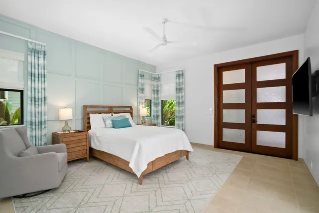 a bedroom with a large bed and a couch