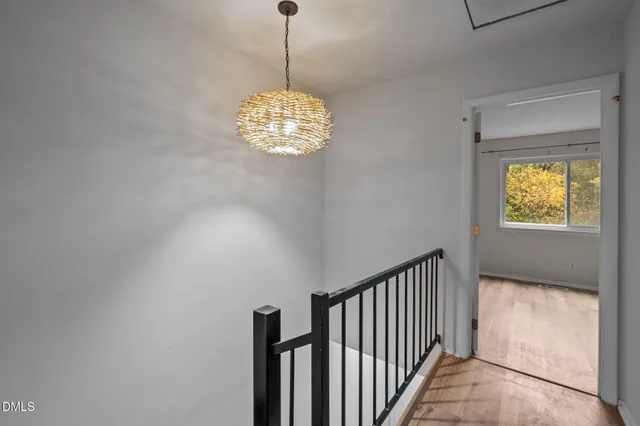a view of a hallway with a chandelier