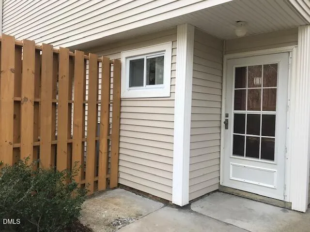 a view of front door and yard