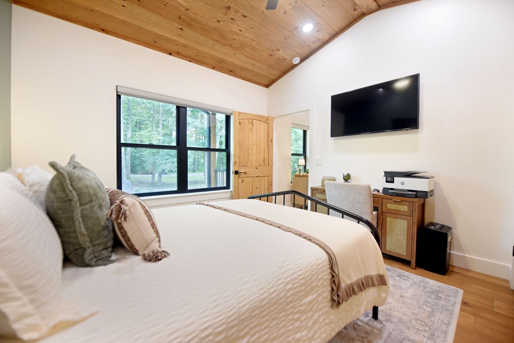 954 Tipton Springs Road Morganton, GA 30560 - Photo 26 of 49 a bedroom with a bed tv and a large window