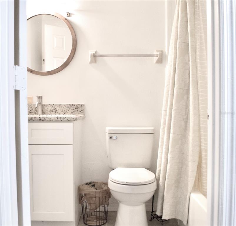 360 Cocoa Court Kissimmee, FL 34758 - Photo 9 of 11 a bathroom with a toilet and a mirror