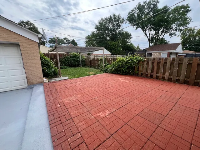 a view of a backyard of the house