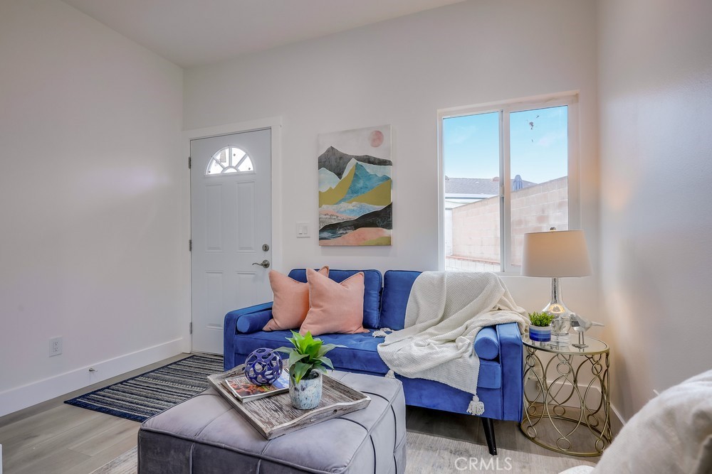 6439 Mohawk Road Westminster, CA 92683 - Photo 13 of 41 a living room with furniture and a potted plant