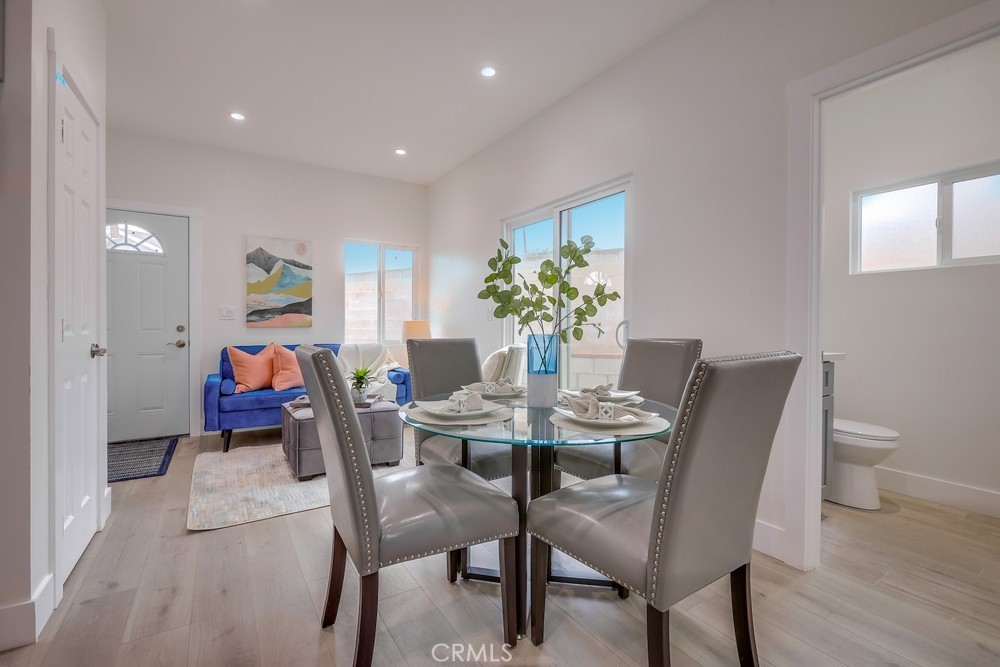 6439 Mohawk Road Westminster, CA 92683 - Photo 14 of 41 a dining room with furniture and wooden floor