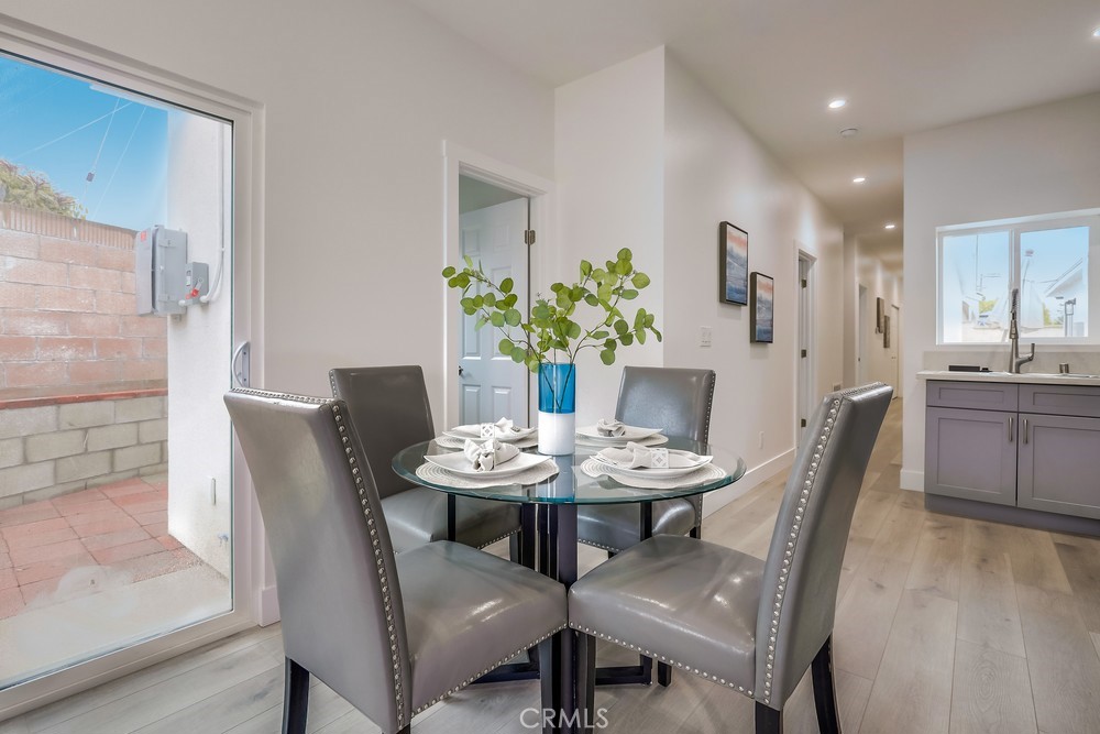 6439 Mohawk Road Westminster, CA 92683 - Photo 15 of 41 a dining room with furniture and wooden floor