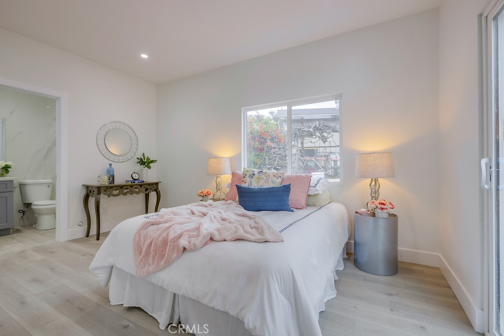 6439 Mohawk Road Westminster, CA 92683 - Photo 23 of 41 a bedroom with a bed and a table