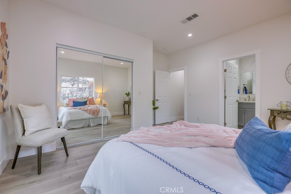 6439 Mohawk Road Westminster, CA 92683 - Photo 24 of 41 a bedroom with a bed and a chair