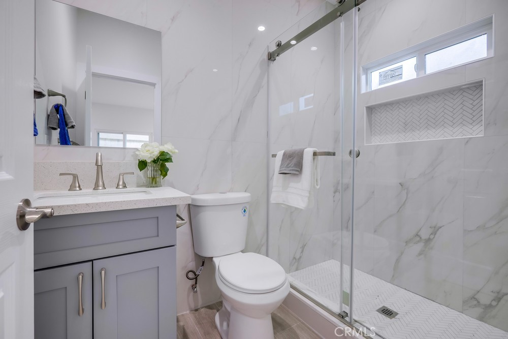 6439 Mohawk Road Westminster, CA 92683 - Photo 25 of 41 a bathroom with a sink toilet and shower