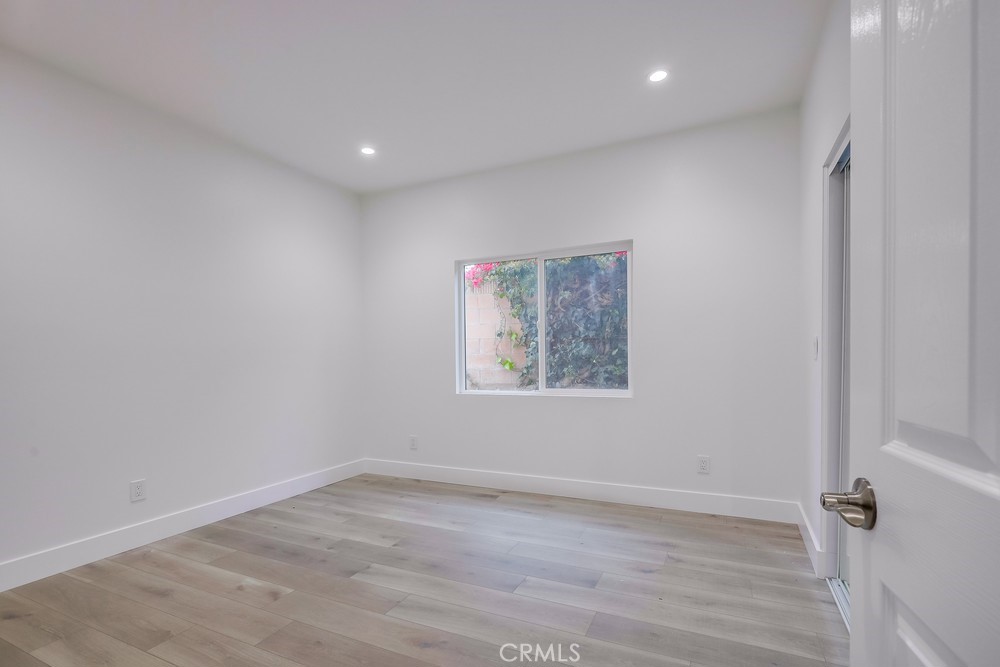 6439 Mohawk Road Westminster, CA 92683 - Photo 27 of 41 a view of empty room with wooden floor and fan