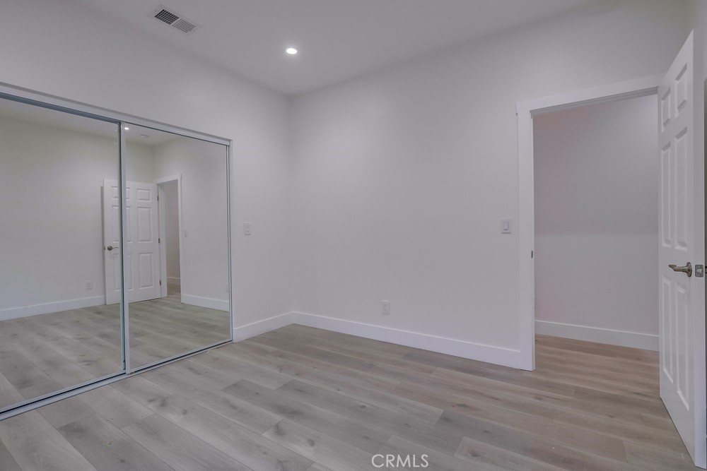 6439 Mohawk Road Westminster, CA 92683 - Photo 32 of 41 a view of an empty room with wooden floor