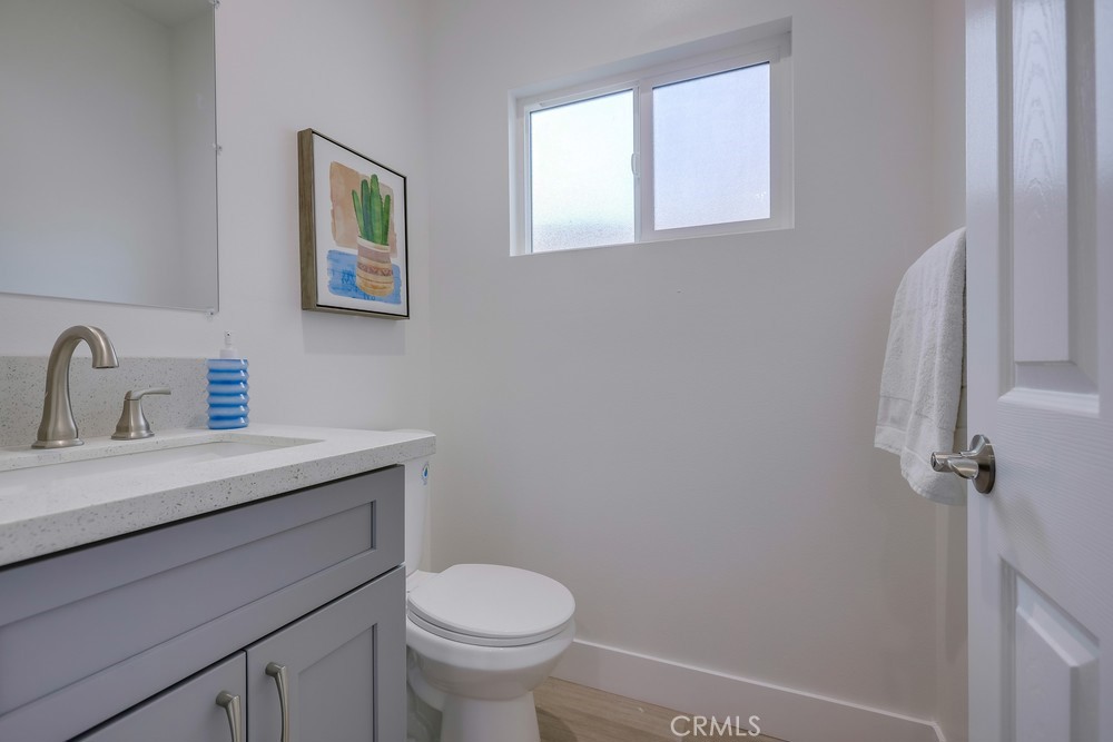 6439 Mohawk Road Westminster, CA 92683 - Photo 34 of 41 a bathroom with a sink a toilet and a window
