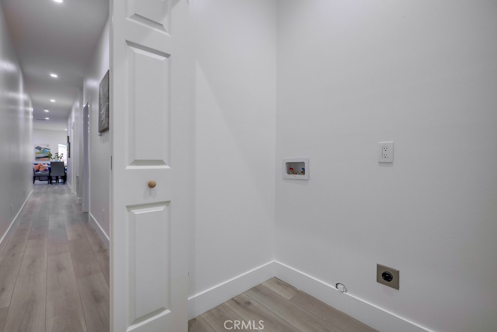 6439 Mohawk Road Westminster, CA 92683 - Photo 36 of 41 a view of a hallway with wooden floor