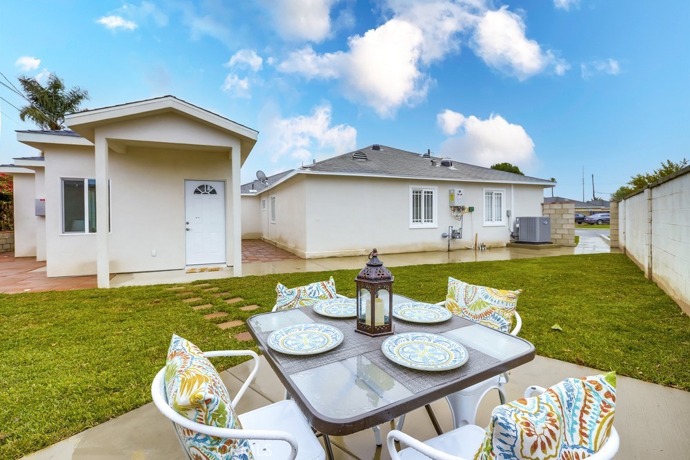 6439 Mohawk Road Westminster, CA 92683 - Photo 4 of 41 a view of a house with backyard sitting area and a garden