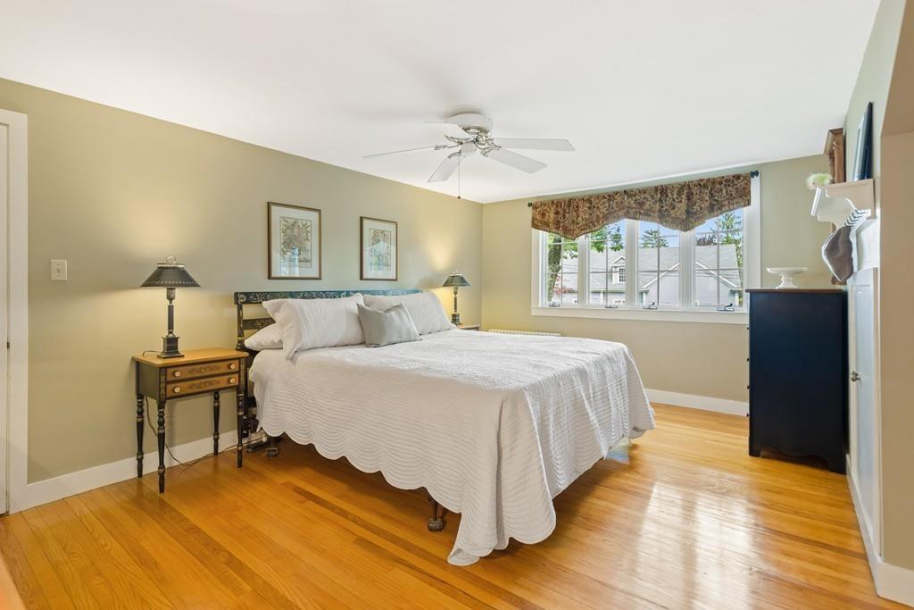 19 Walnut Street Lexington, MA 02421 - Photo 15 of 22 a spacious bedroom with a bed and a table