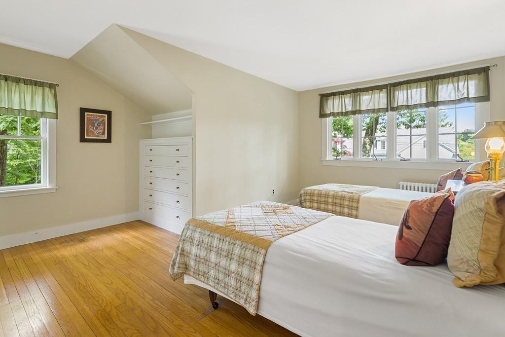 19 Walnut Street Lexington, MA 02421 - Photo 17 of 22 a bedroom with a bed and a window