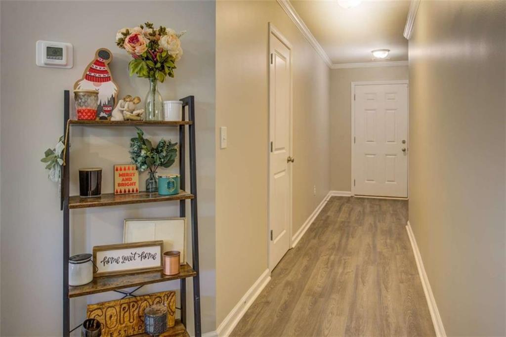 160 Savannah Way Milner, GA 30257 - Photo 16 of 41 a view of hallway with baby toys and dresser
